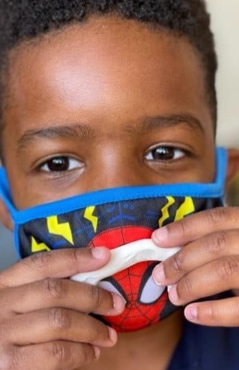 black boy with mask up close