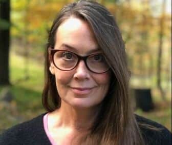 Carol Garboden Murray, a woman with dark brown hair and brown glasses