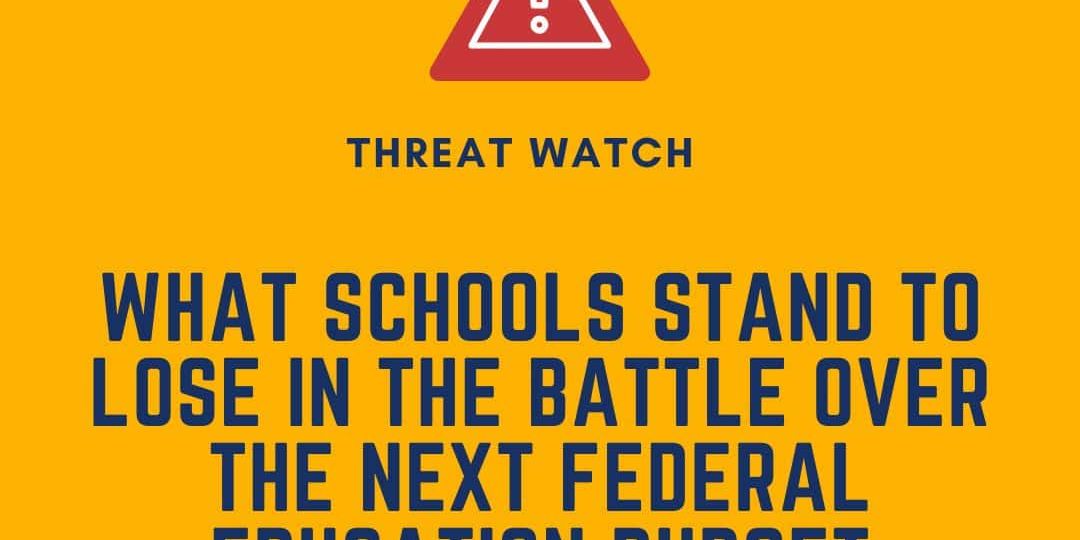 A graphic with a warning symbol and the text: "What schools stand to lose in the battle over the next federal education budget," with the DEY logo and website.
