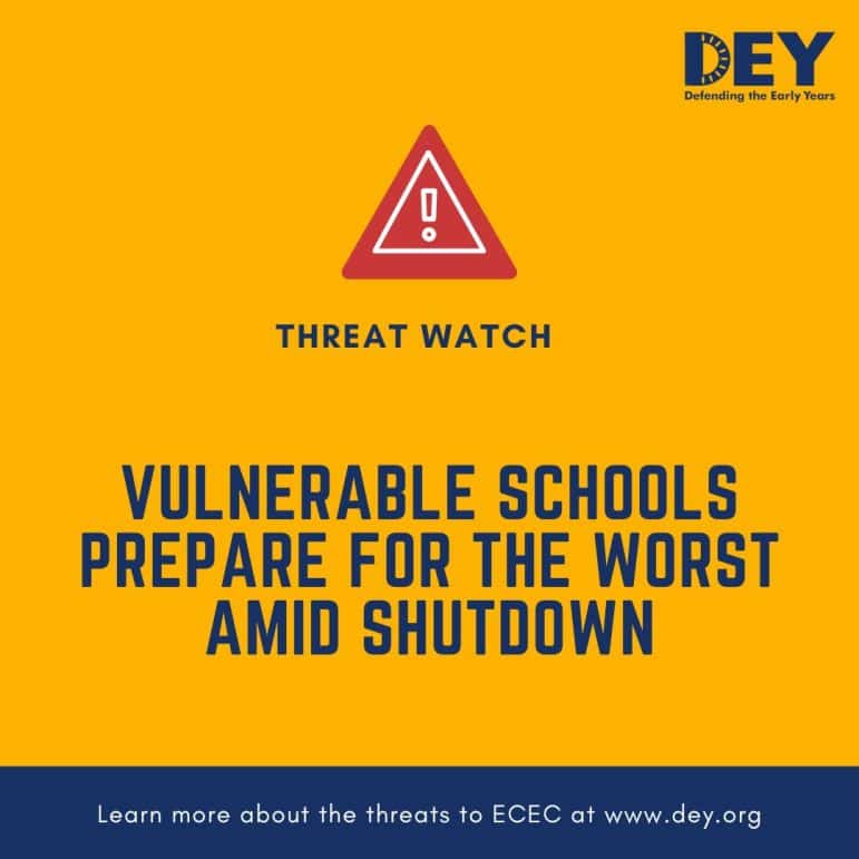 A warning sign above text reading 
