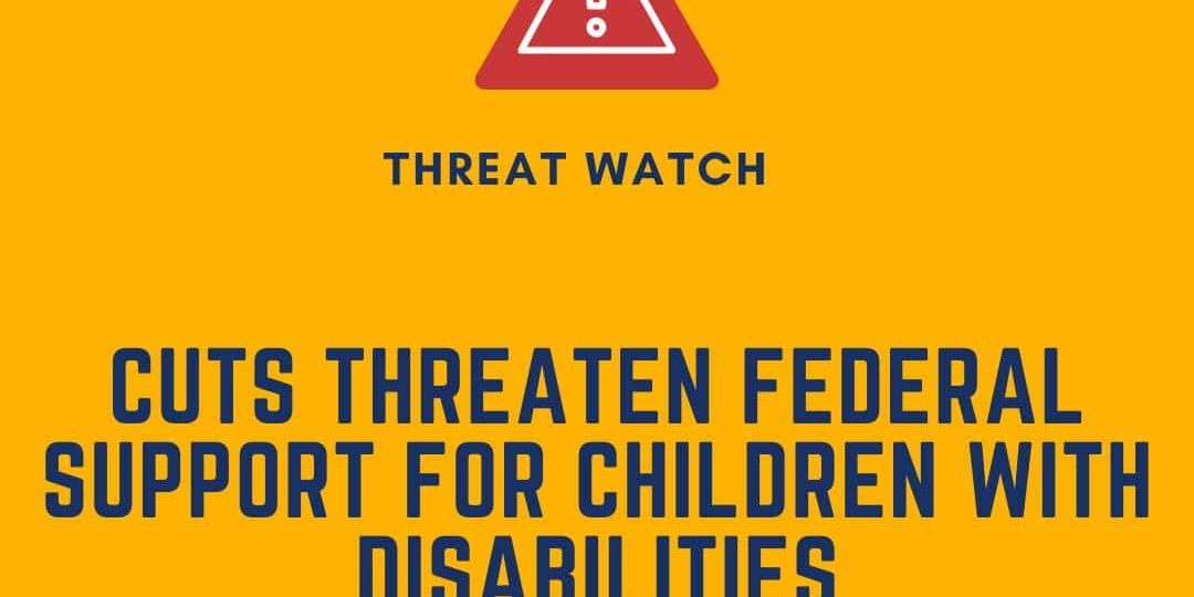 A warning sign with text stating, "Cuts threaten federal support for children with disabilities," from DEY, Defending the Early Years.